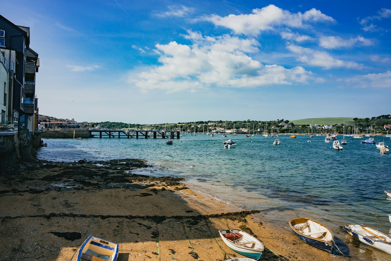 Falmouth — a group of boats sitting on top of a beach