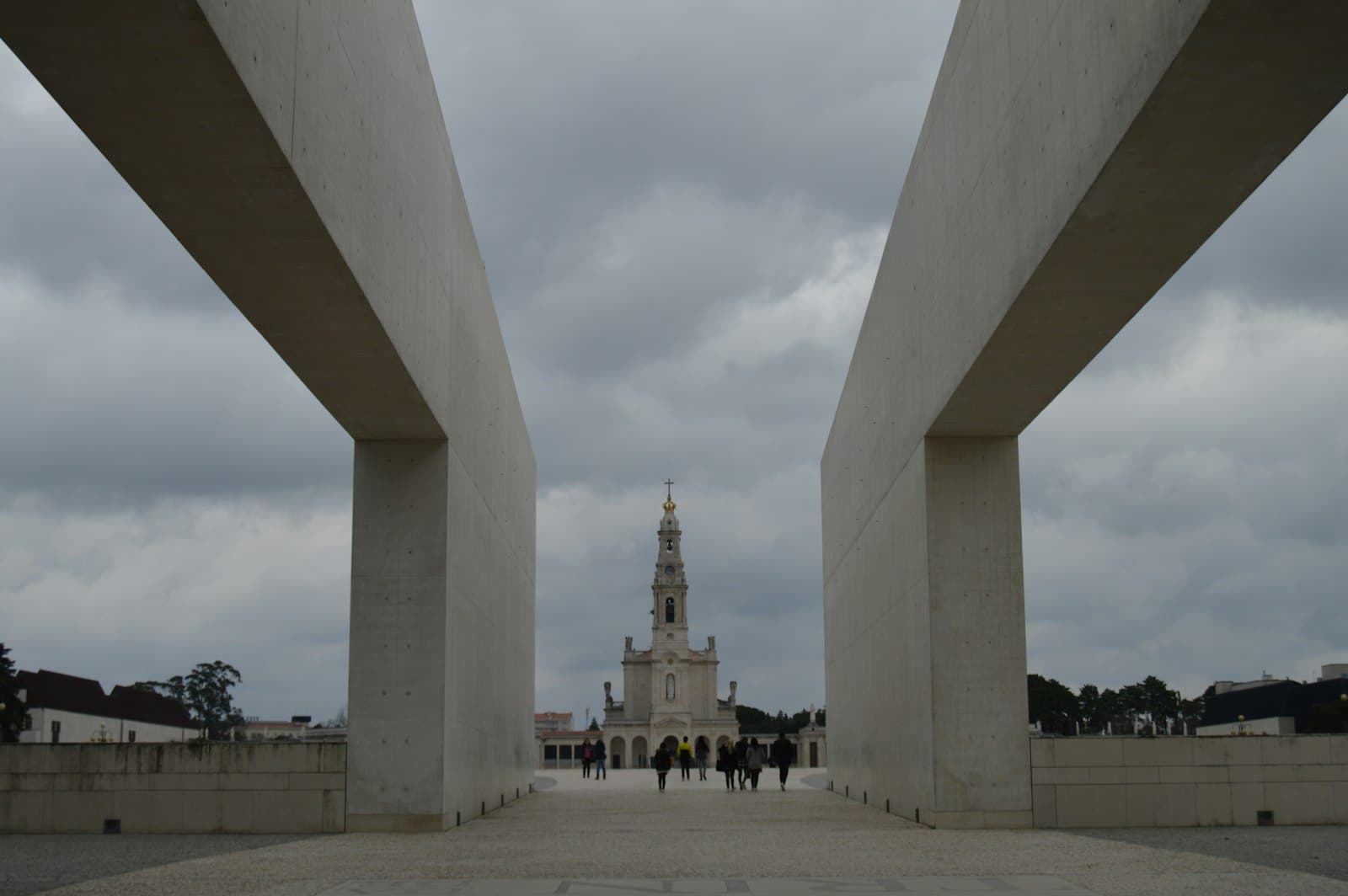 Fátima — A view of a bridge with a clock tower in the background