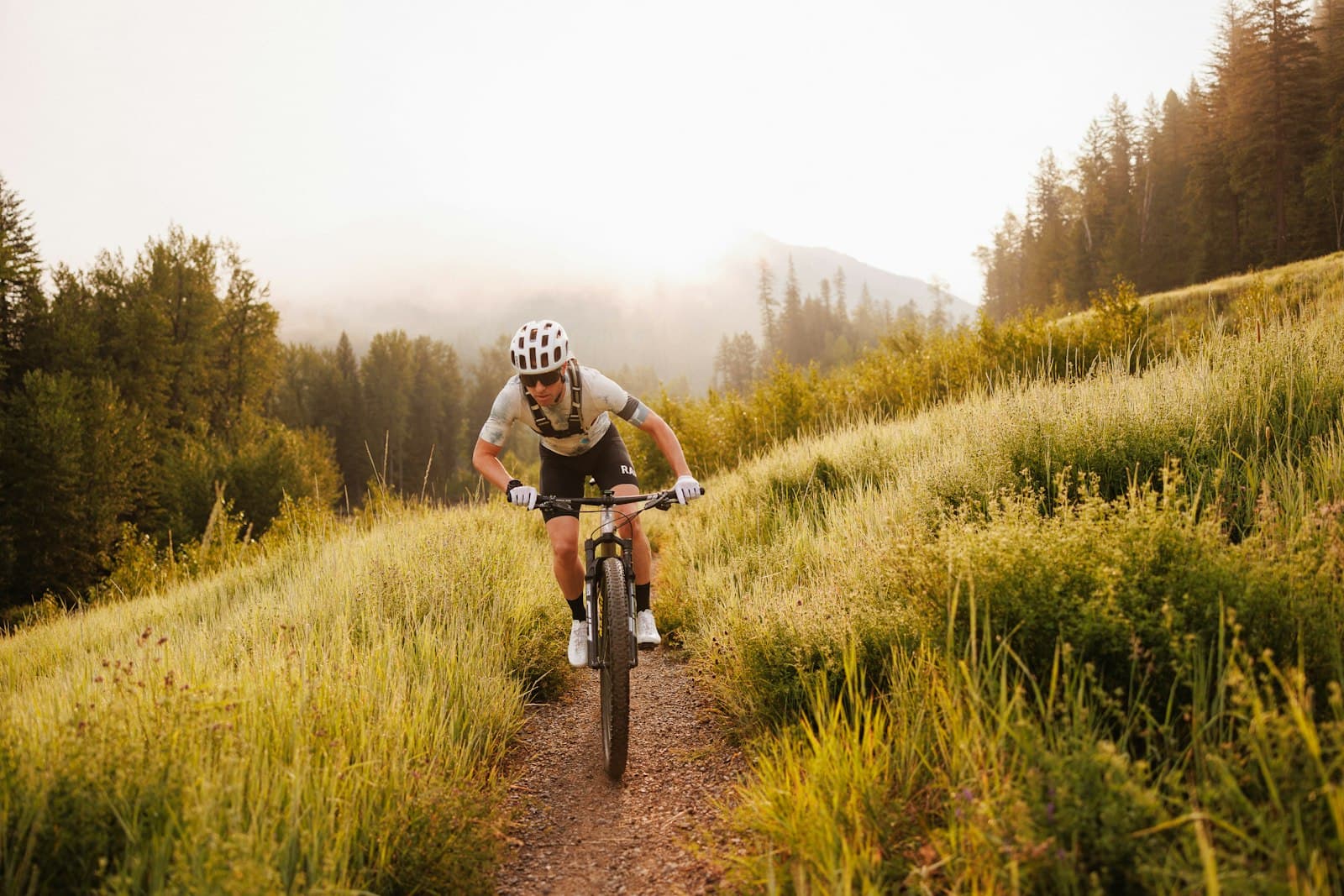 Fernie — A man riding a bike down a dirt road