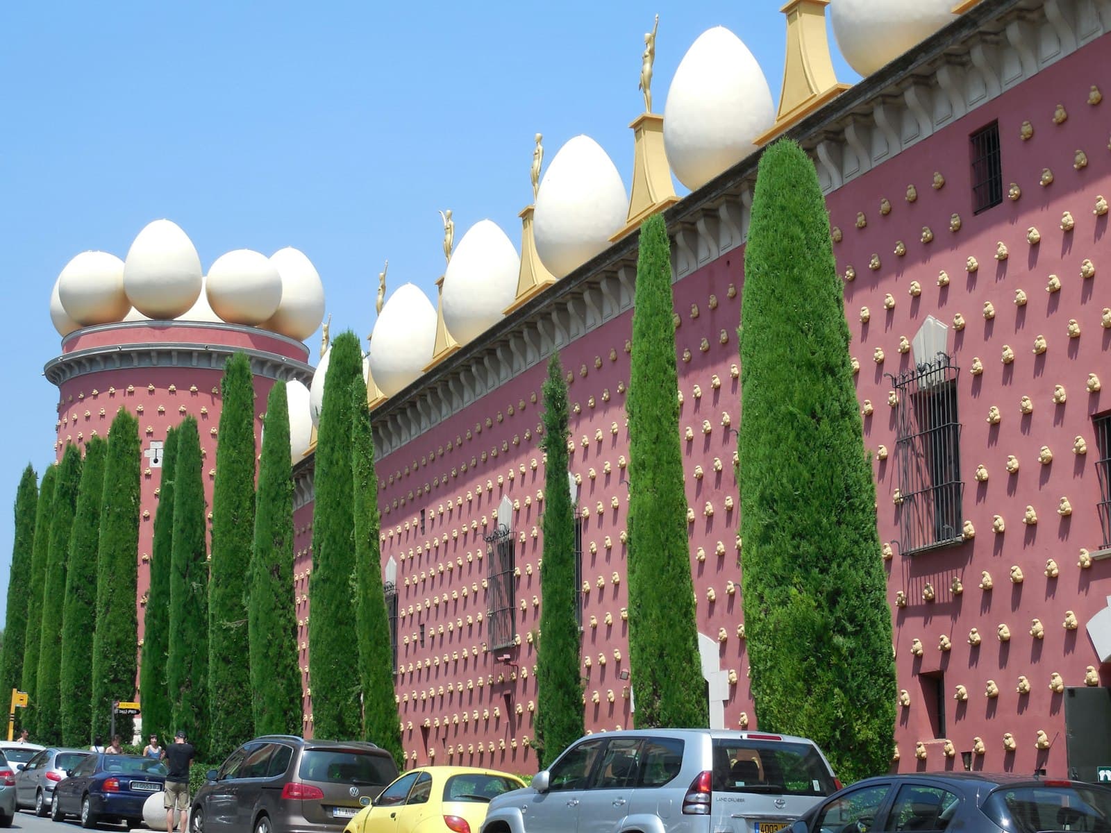 Figueres — a row of trees line the side of a building