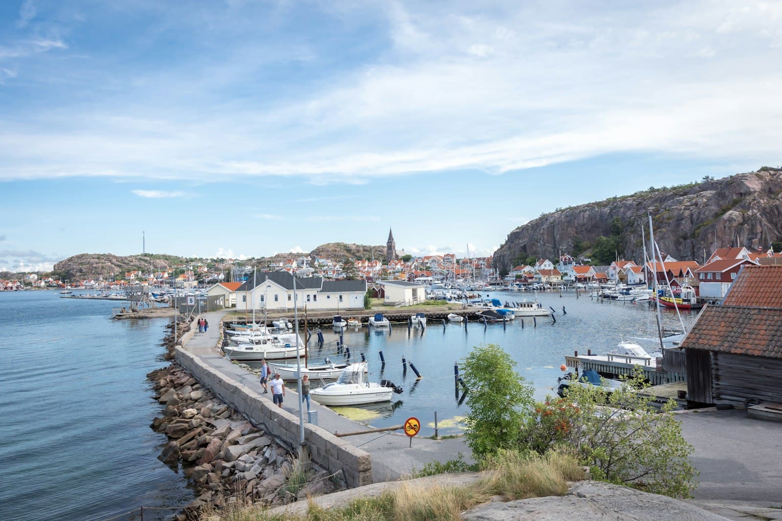 Fjällbacka — a harbor filled with lots of boats next to a hillside
