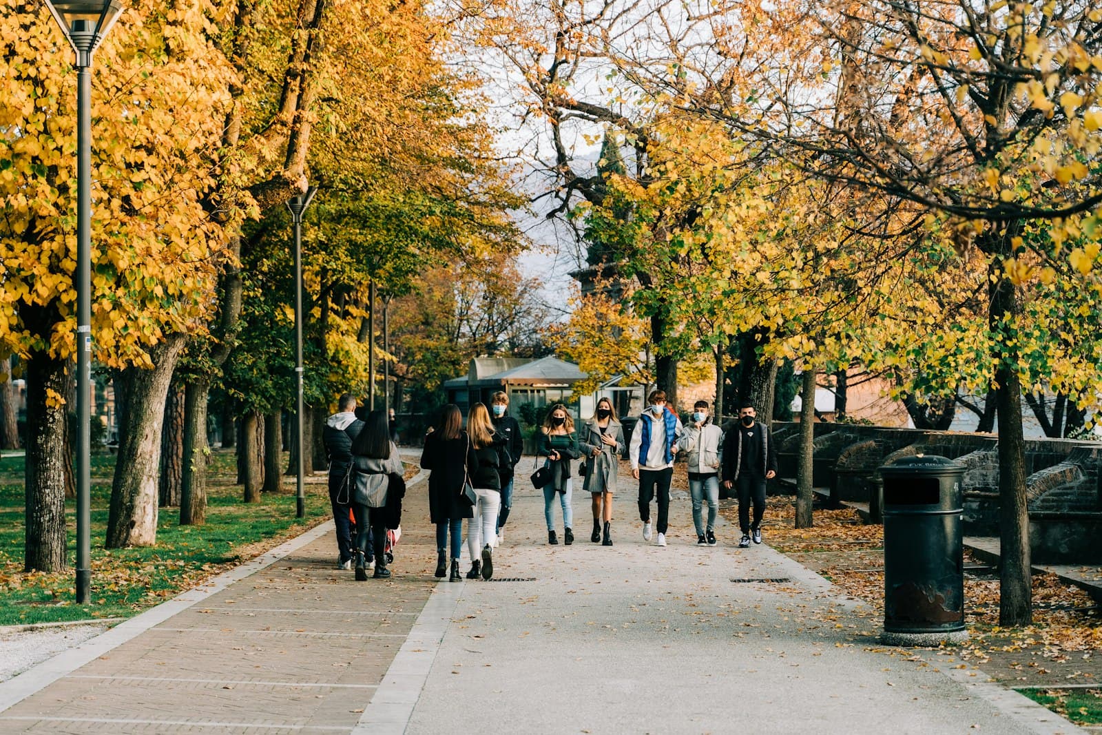 Foligno — people walking on sidewalk near trees during daytime