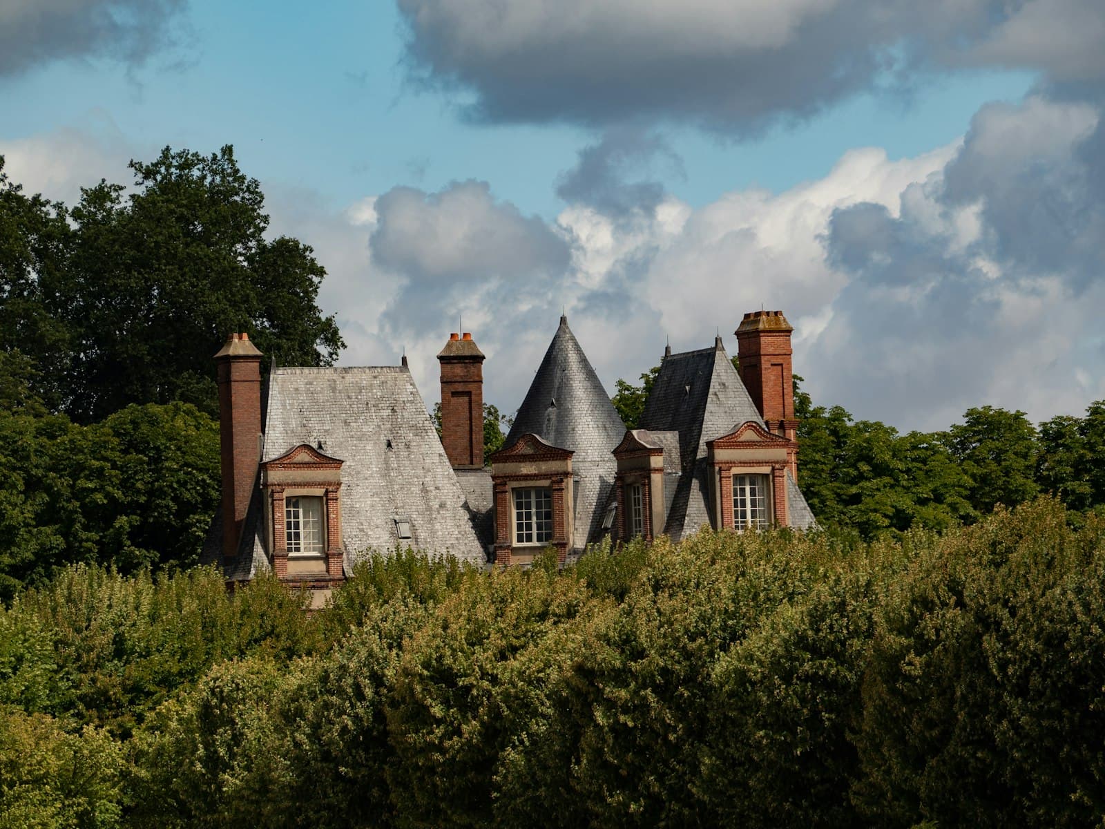 Fontainebleau — A beautiful house is nestled among lush greenery.
