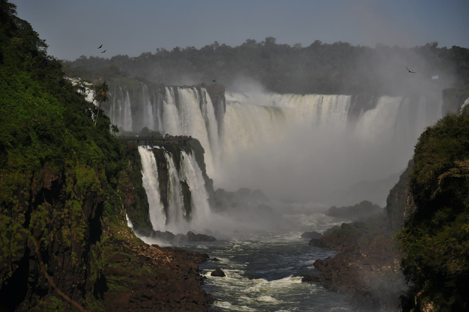 Foz do Iguaçu — a waterfall with a bridge and trees