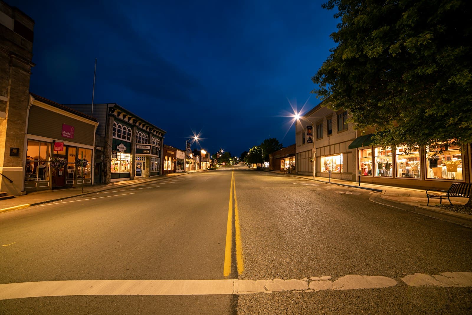 Friday Harbor — gray concrete road between buildings during night time