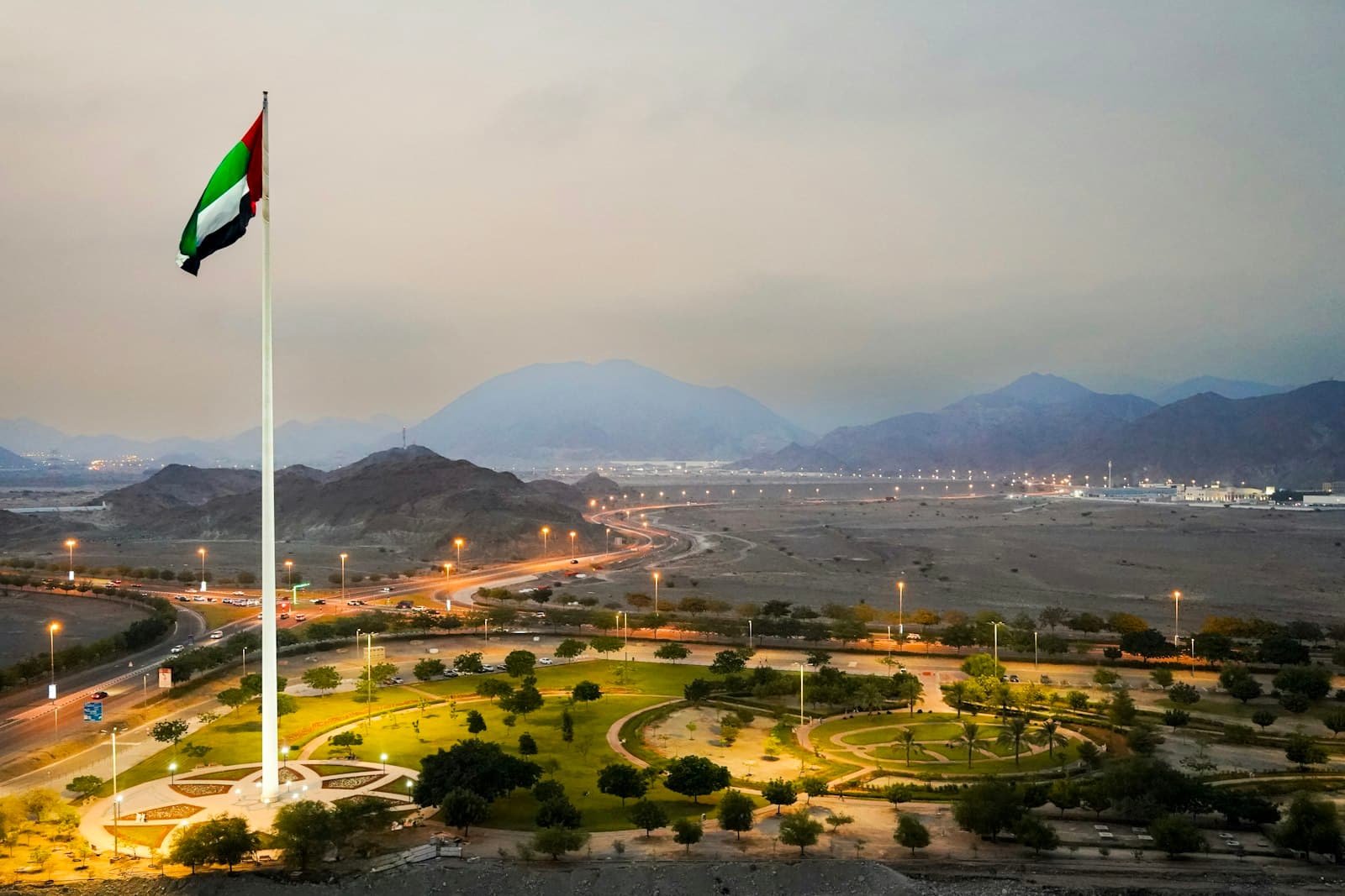 Fujairah — A flag pole with a flag on top of it