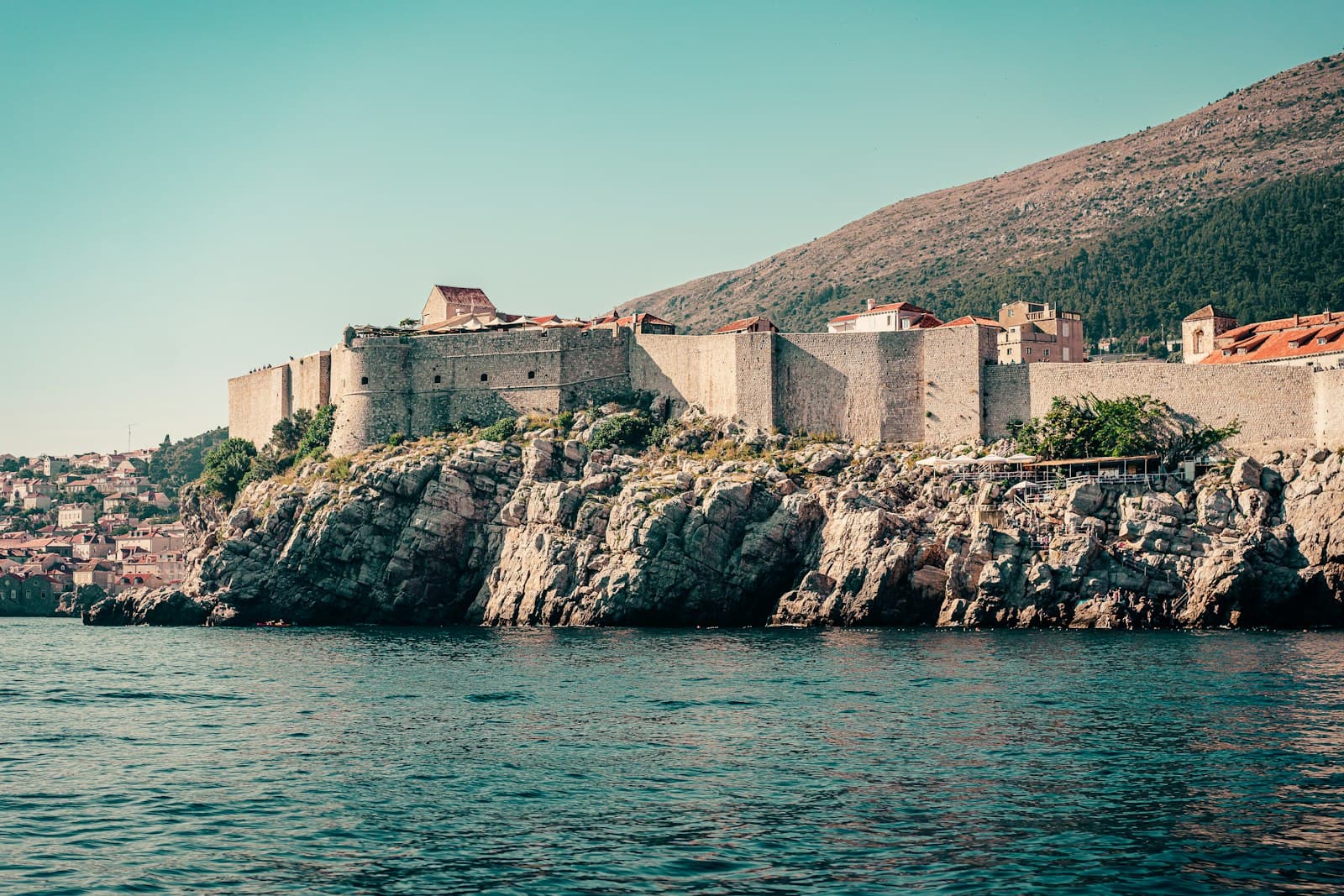 Game of Thrones in Dubrovnik — brown concrete building on rock formation near body of water during daytime