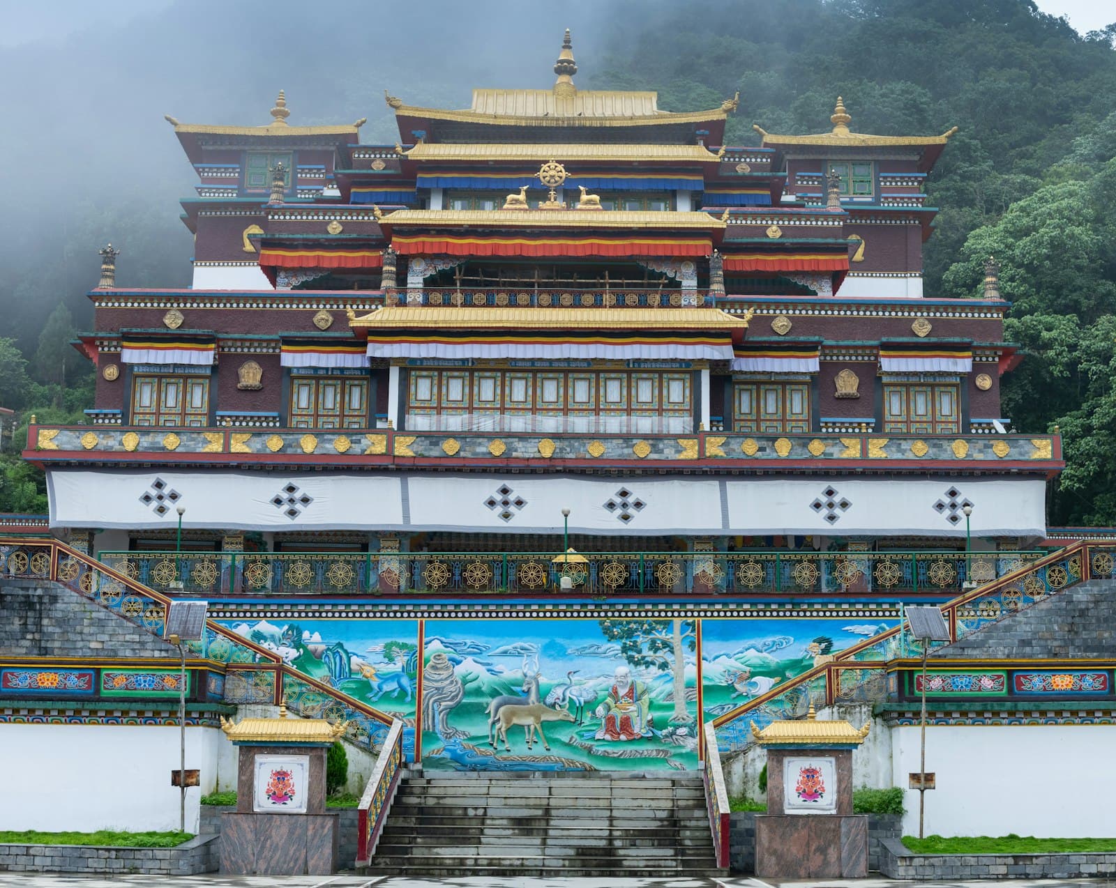 Gangtok — a large building with a mural on the side of it