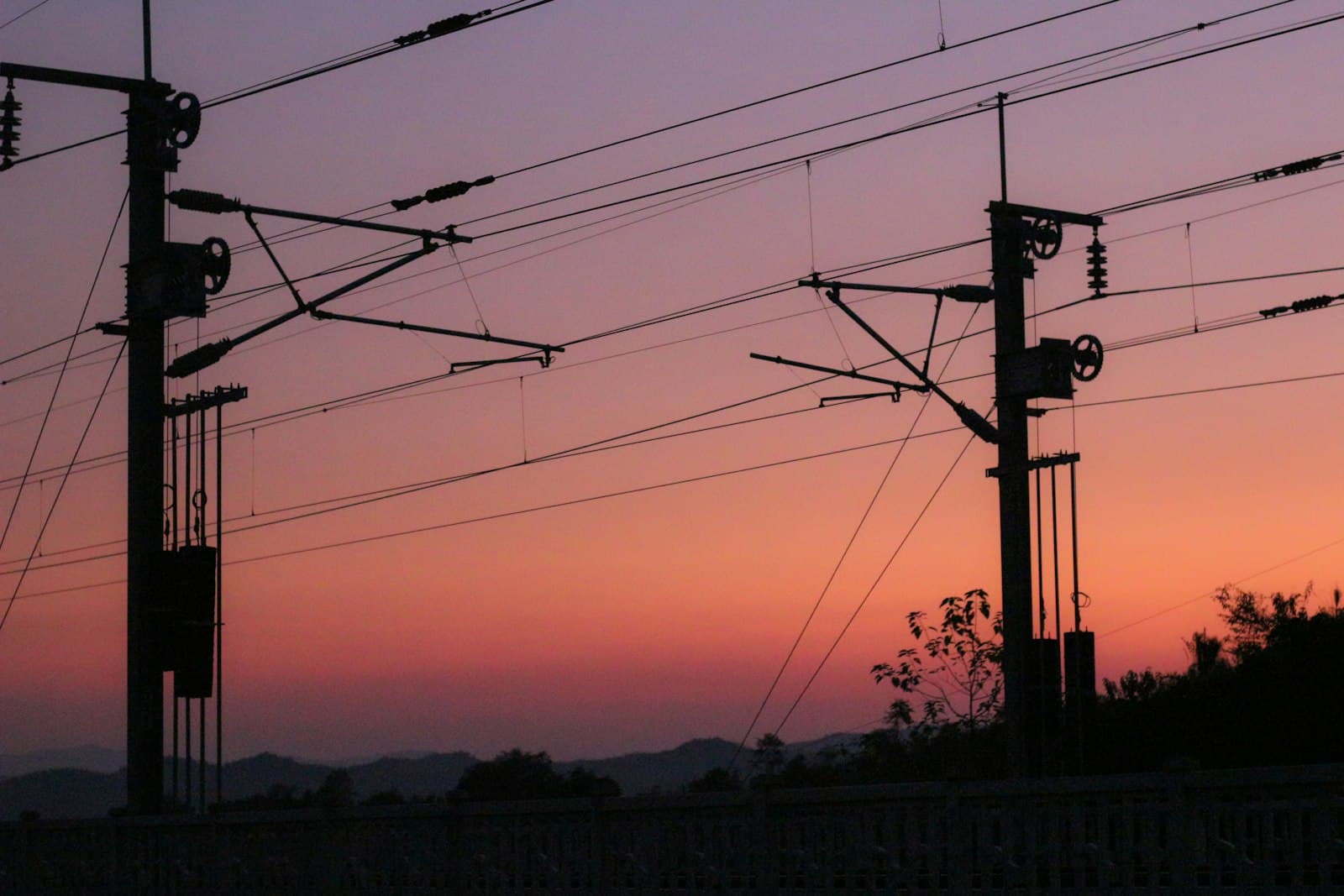 Ganzhou — the sun is setting behind some power lines