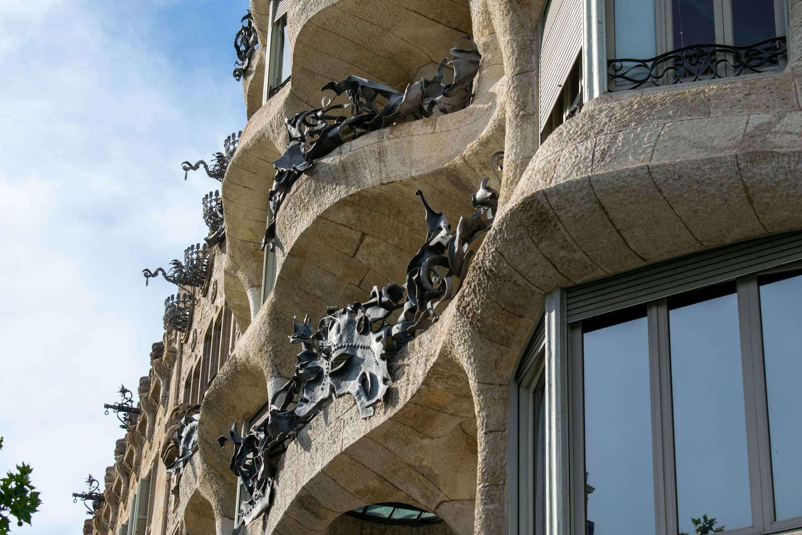 Gaudí & the Modernists — a building with sculptures on the side of it