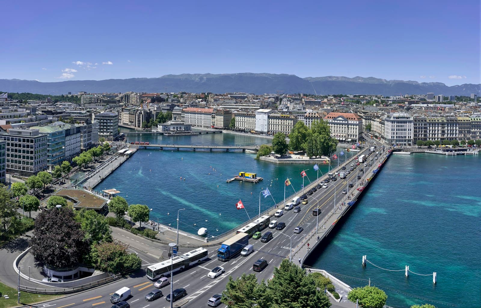 Geneva — aerial view of city buildings near body of water during daytime