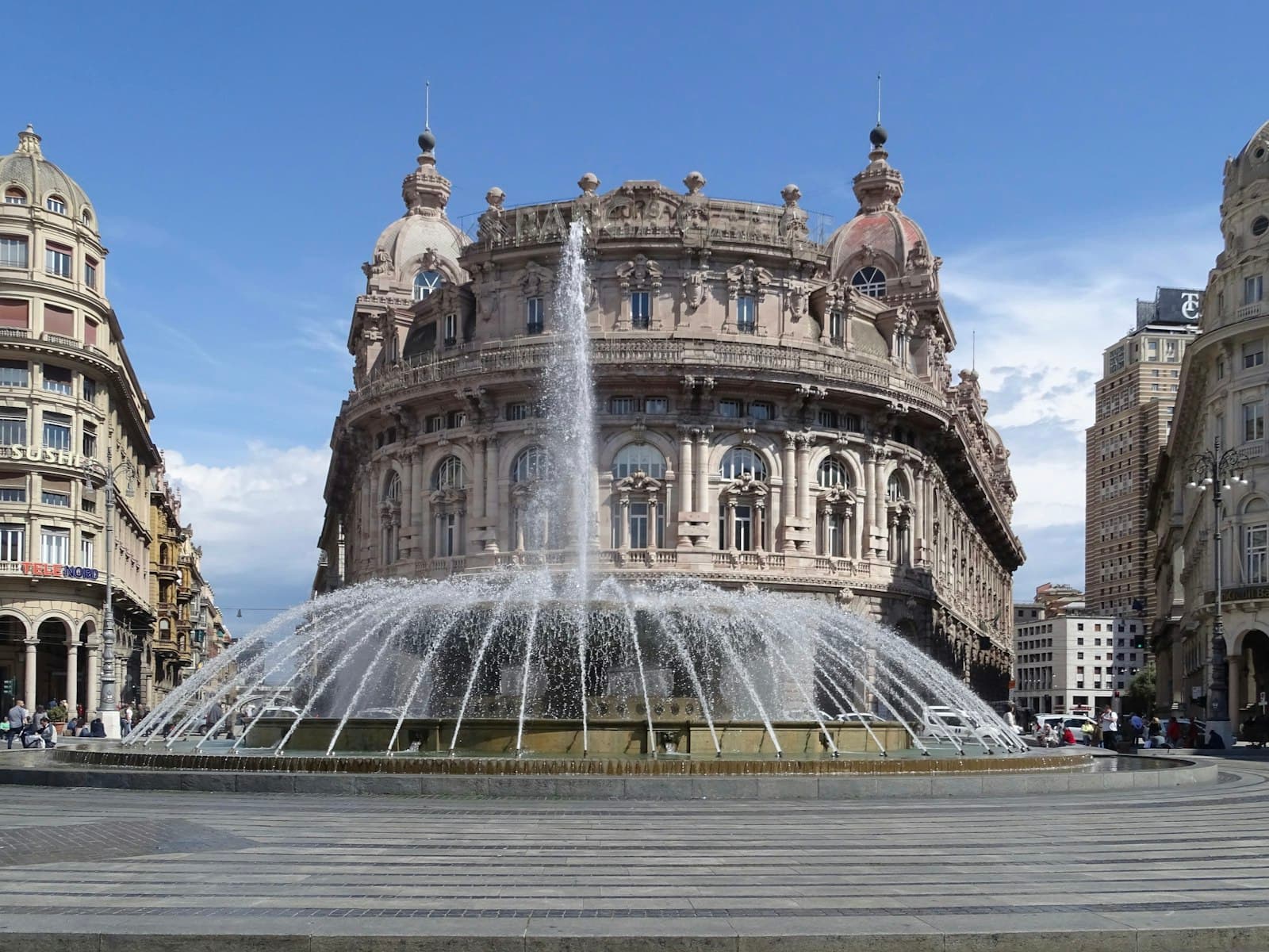 Genoa — white concrete building with water fountain during daytime
