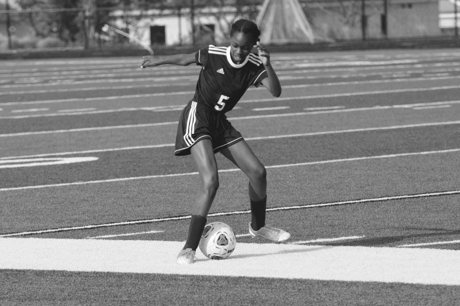 Georgetown — grayscale photography of woman playing soccer
