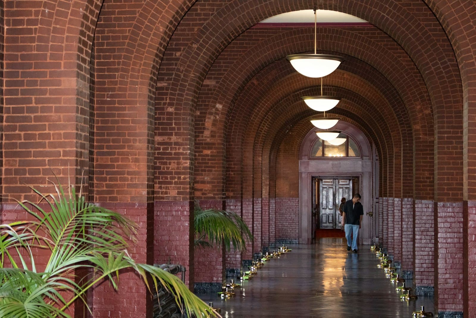 Georgetown — A long brick corridor leads towards a doorway.