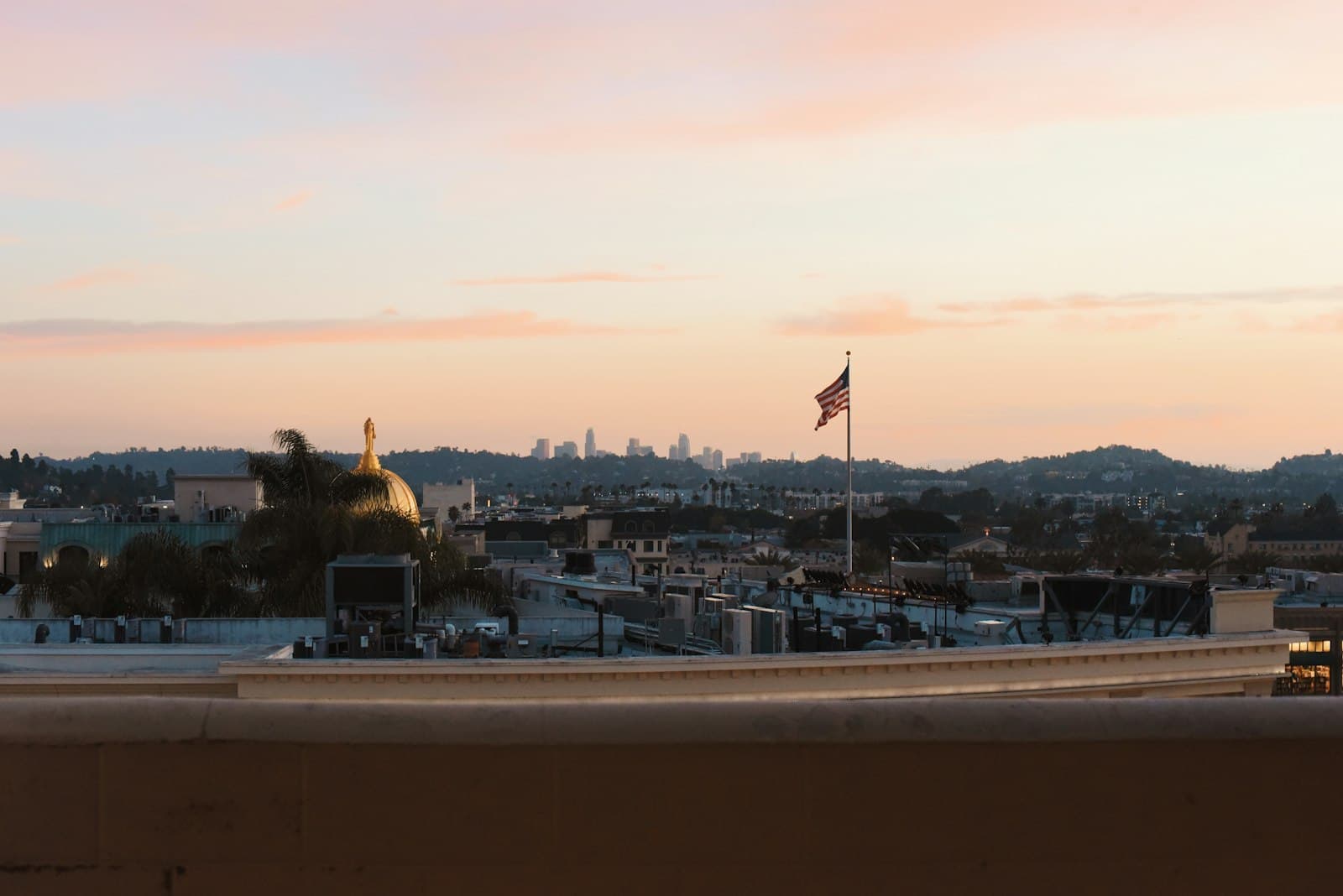 Glendale — City skyline with american flag at sunset.