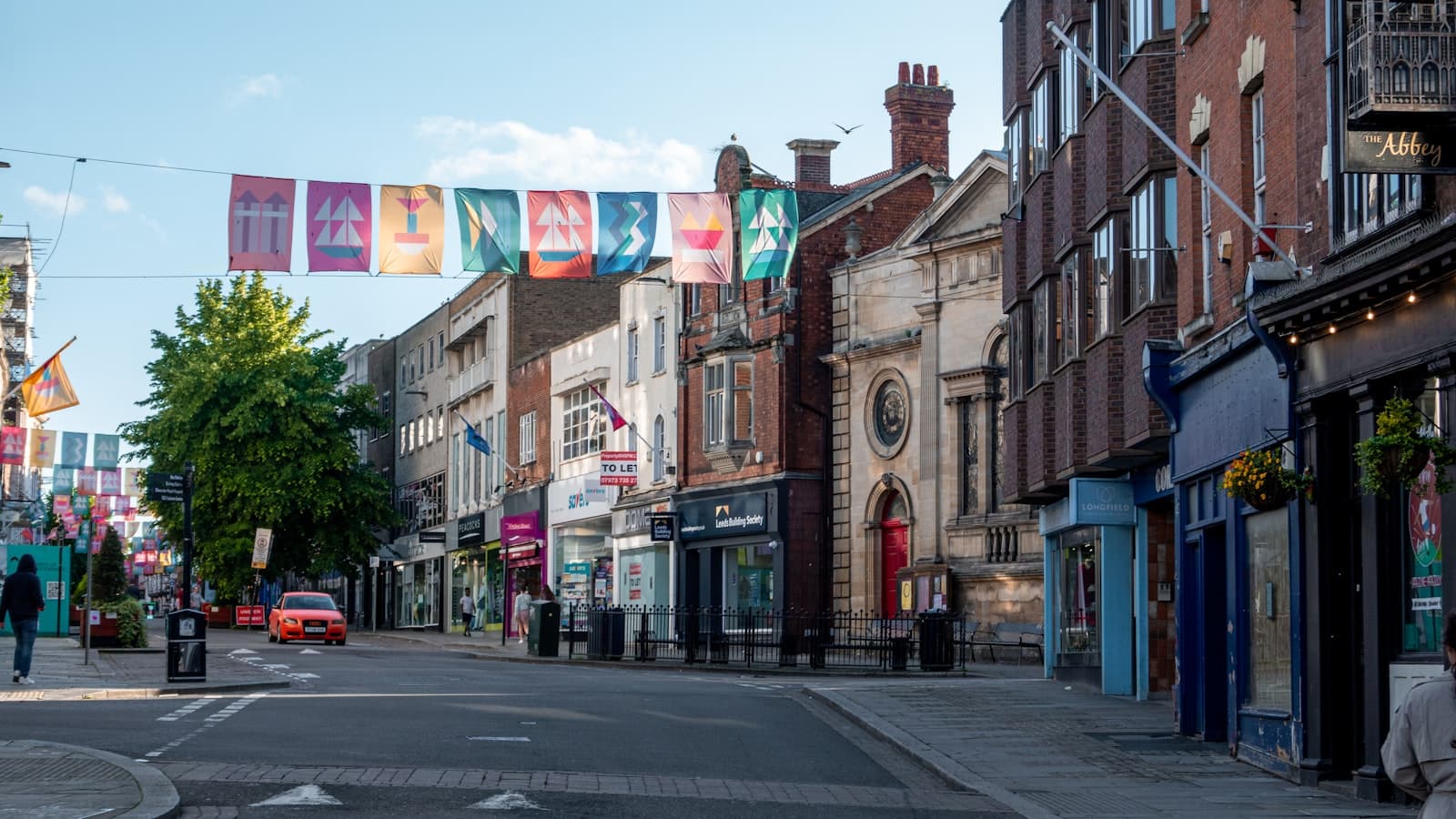 Gloucester — A city street filled with lots of tall buildings