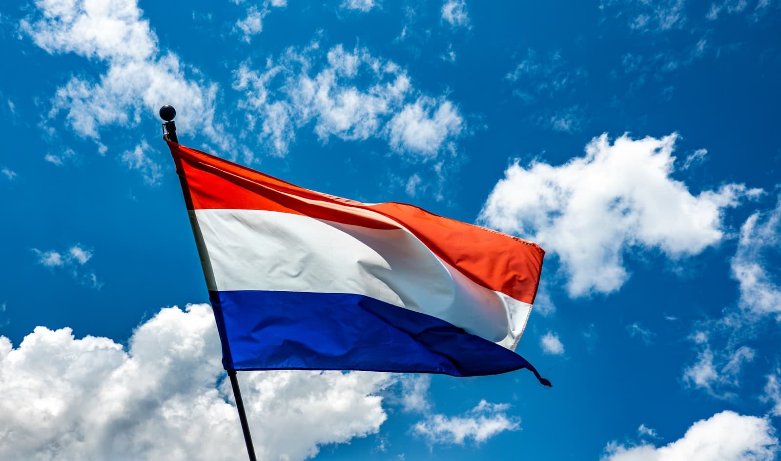 Goes — A red white and blue flag flying in the sky