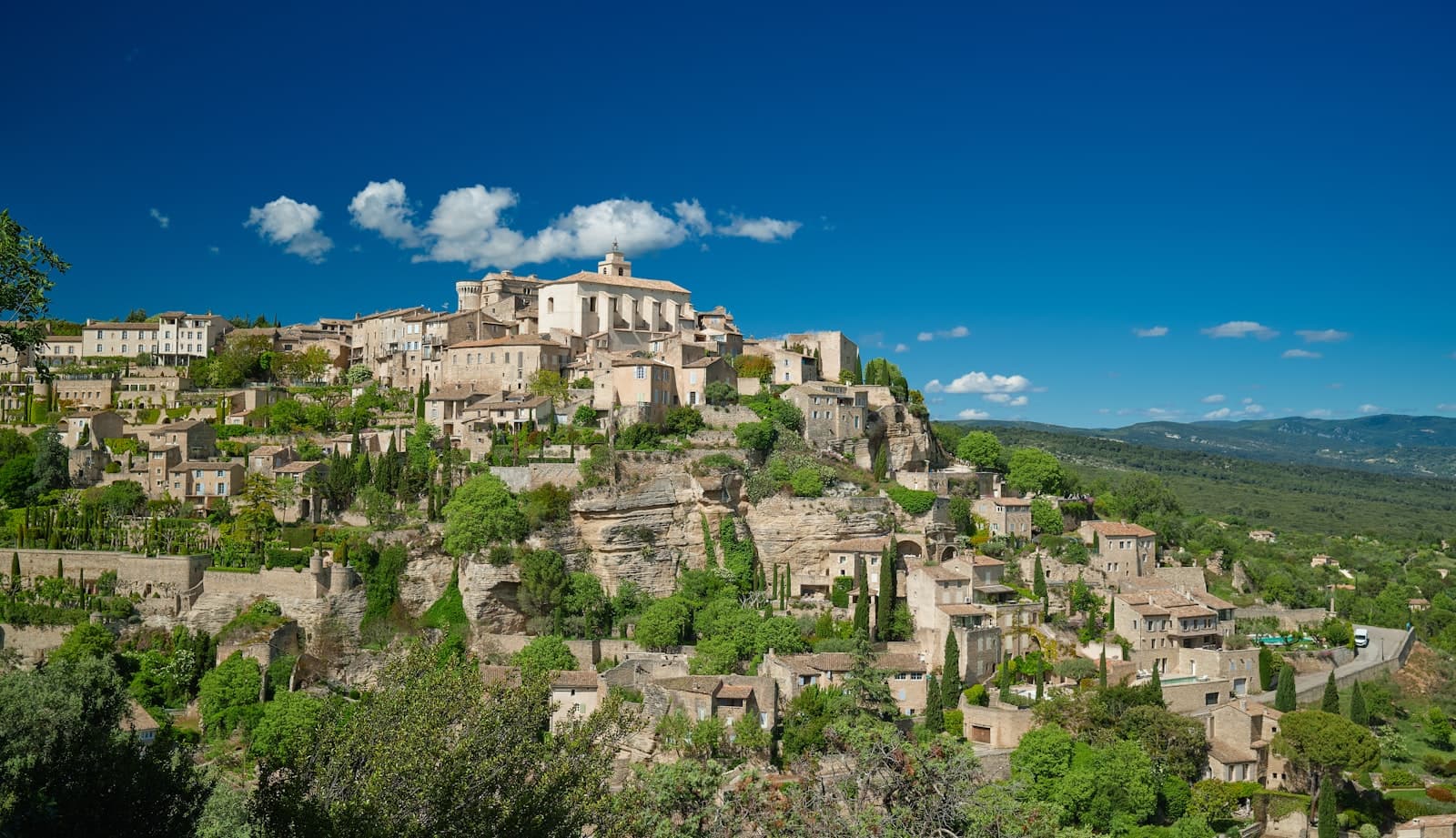 Gordes — brown concrete building on top of mountain during daytime