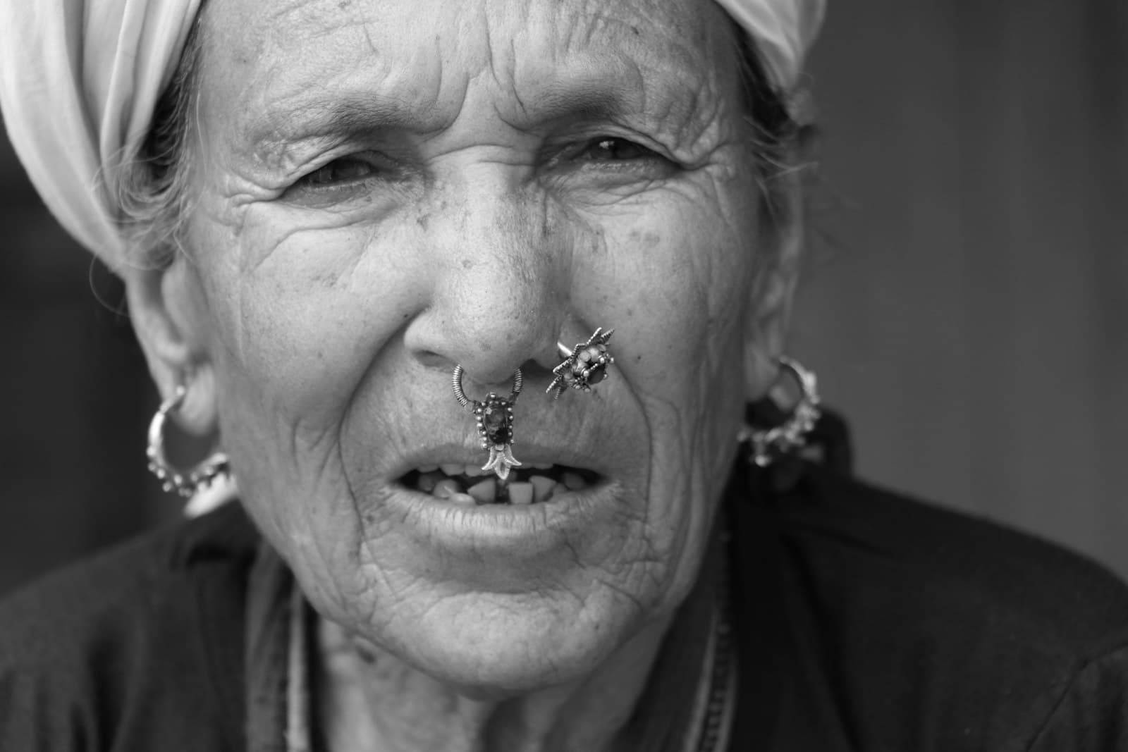 Gorkha — woman wearing head scarf and nose rings in close-up photo