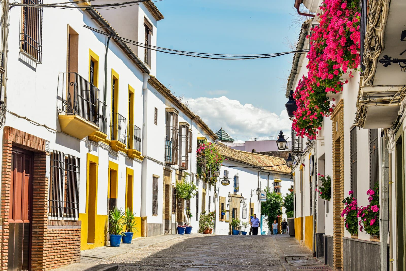 Granadilla — A cobblestone street lined with white and yellow buildings
