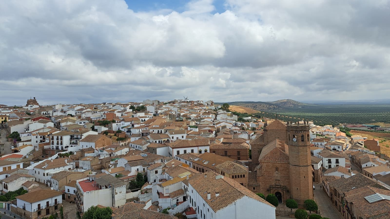 Granadilla — an aerial view of a city with a clock tower