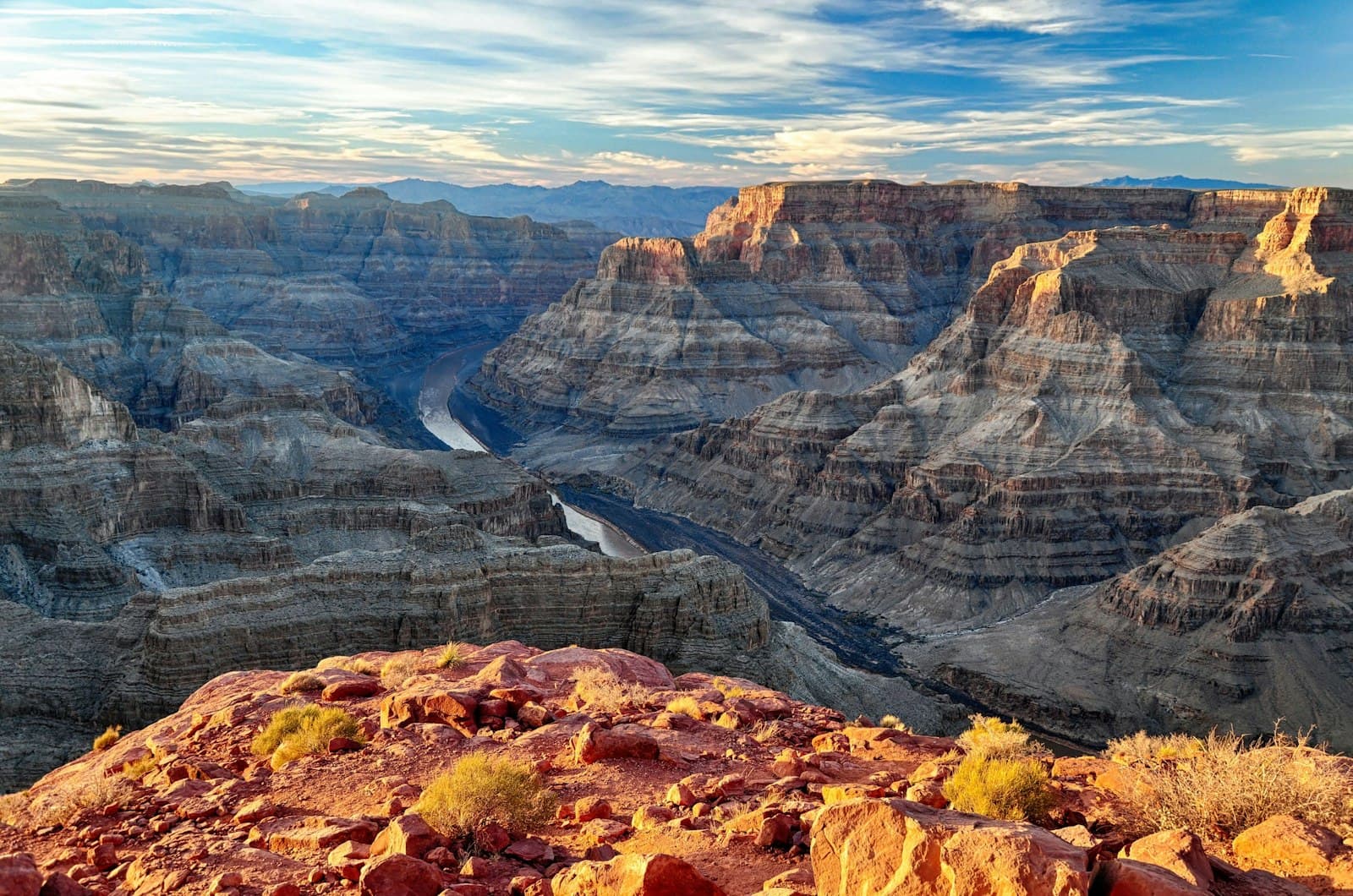 Grand Junction — brown rocky mountain under white clouds during daytime