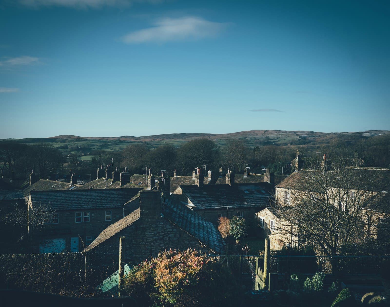 Grassington — a view of a town with a mountain in the background