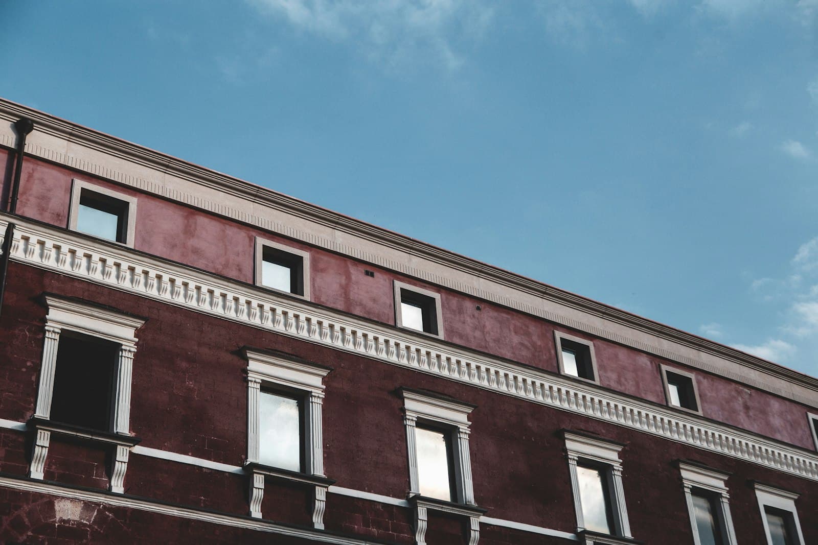 Gravina in Puglia — a red building with a clock on the side of it