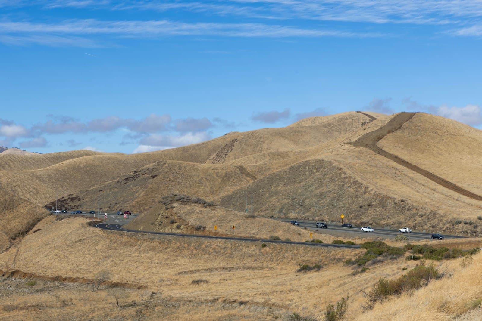 Green Bay — A scenic view of a mountain with a highway going through it