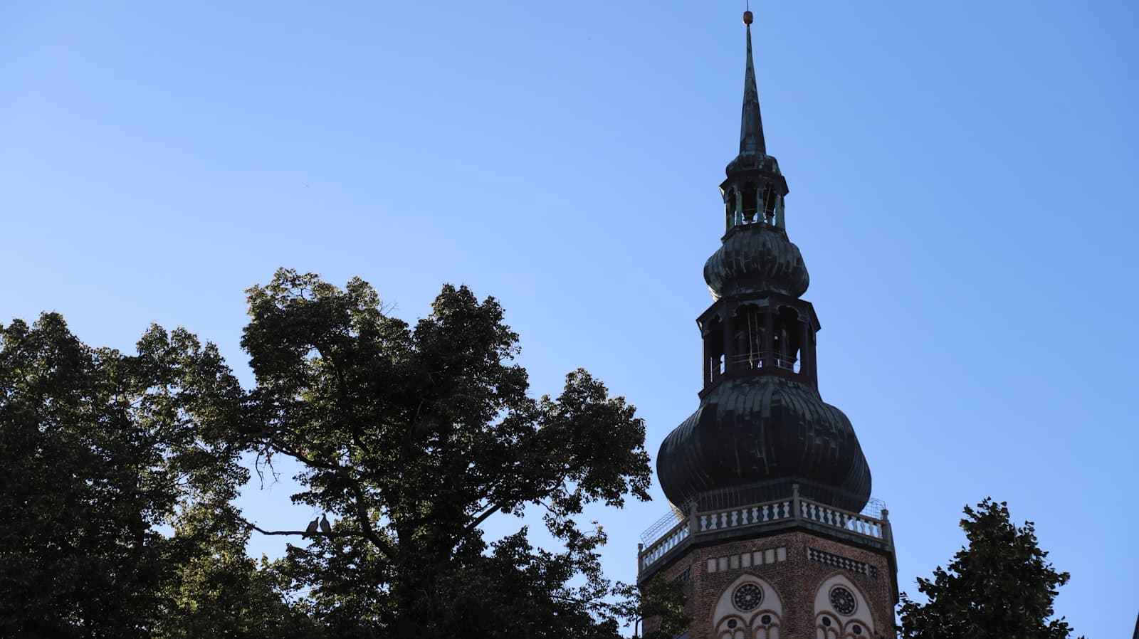 Greifswald — Church steeple against a clear blue sky.