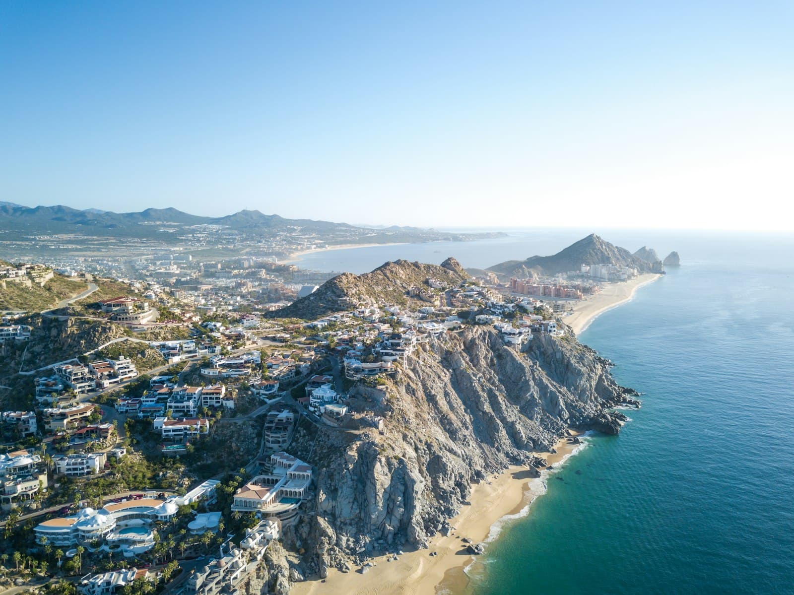 Guadalupe — aerial photography of mountain with village near sea
