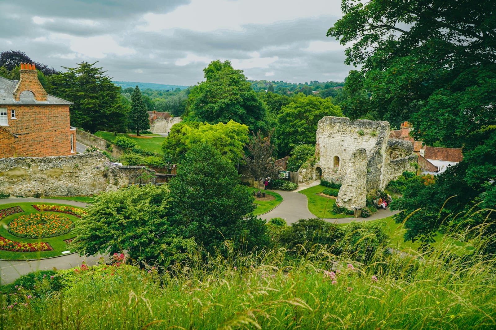 Guildford — An old stone building surrounded by greenery.