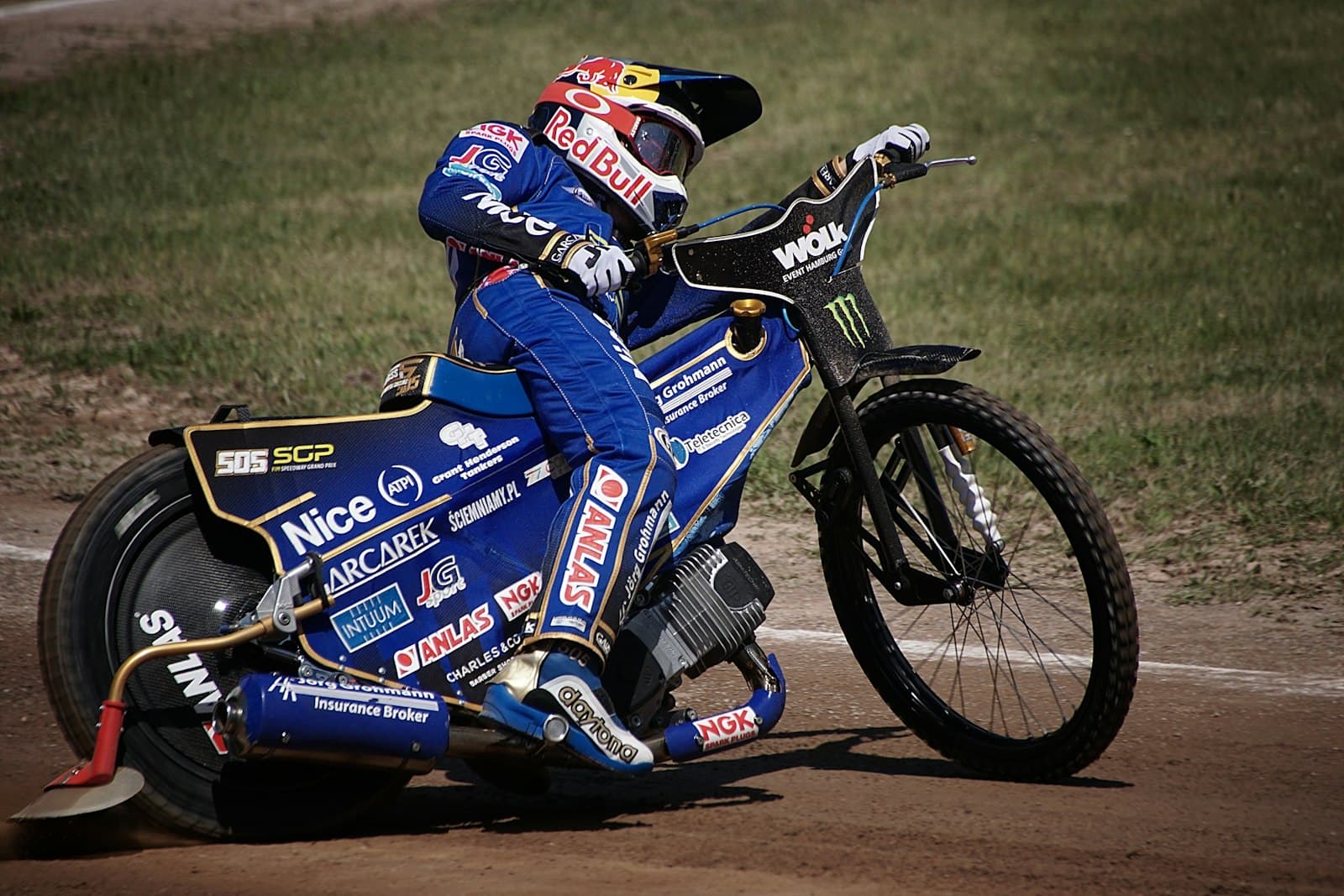 Güstrow — a man riding a motorcycle on top of a dirt road