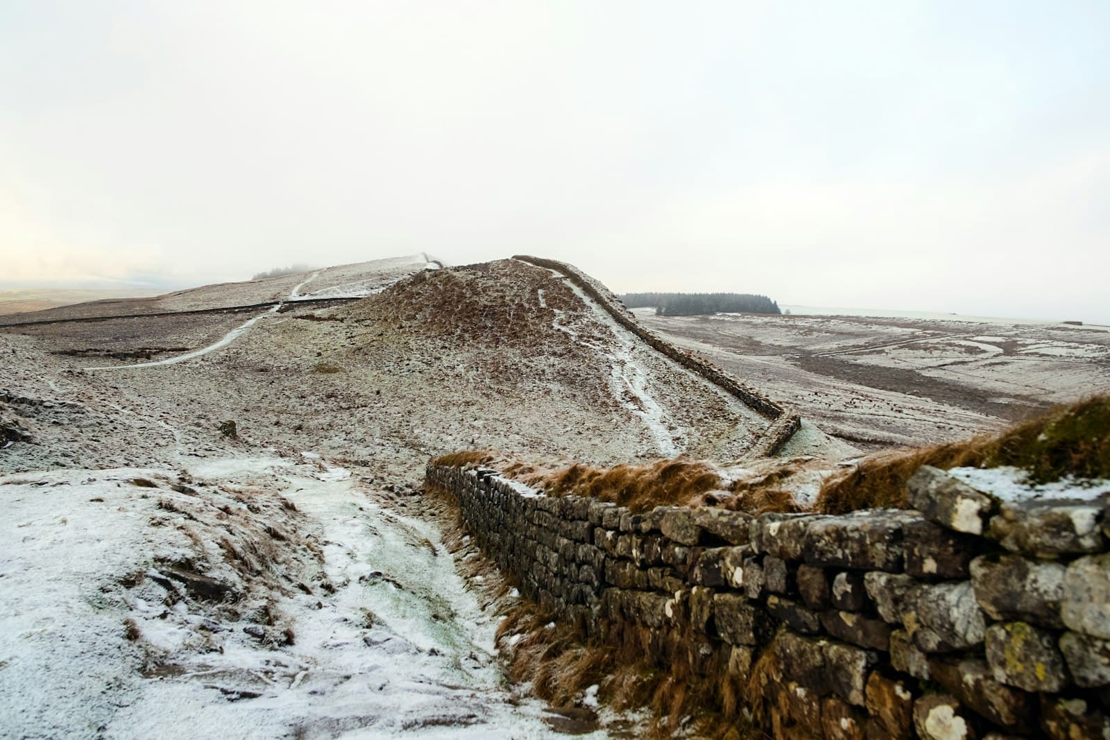 Hadrian's Wall — landscape photography of grey bricked wall near mountain