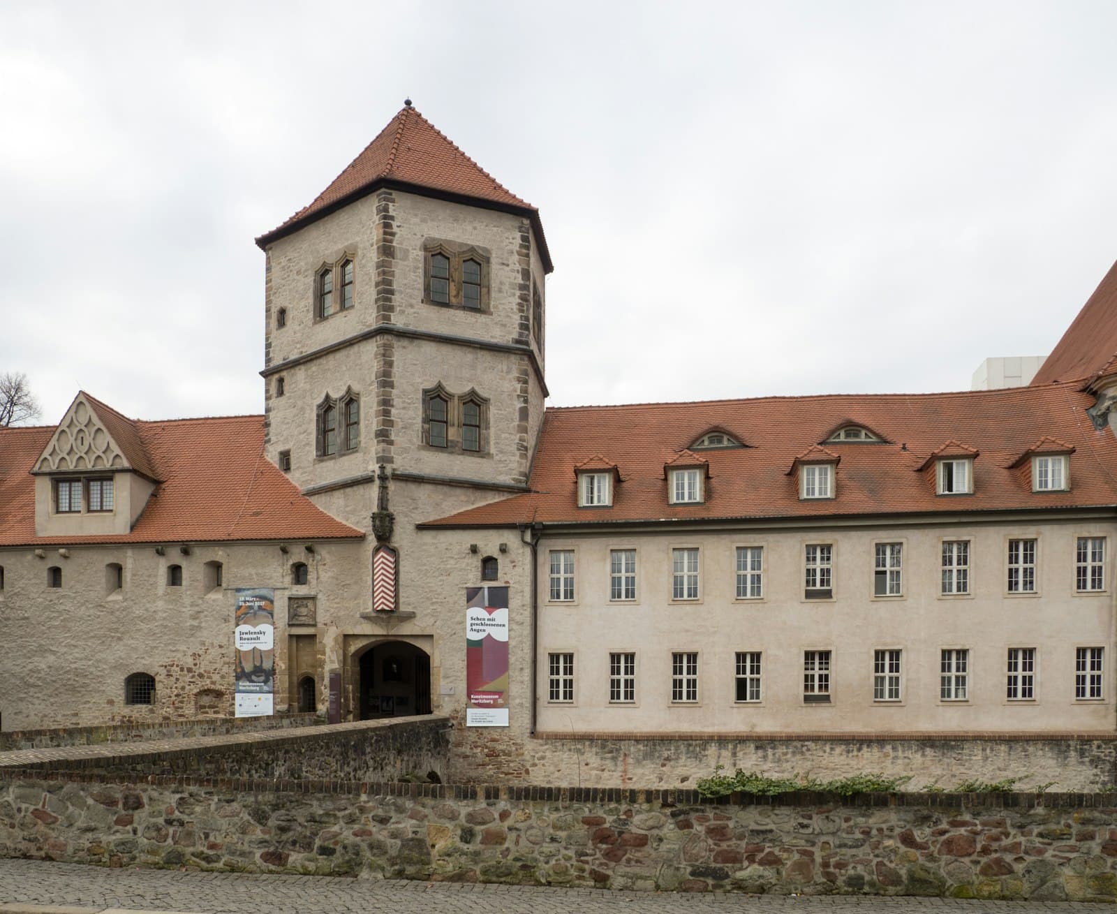 Halle (Saale) — brown and white concrete building under white clouds during daytime
