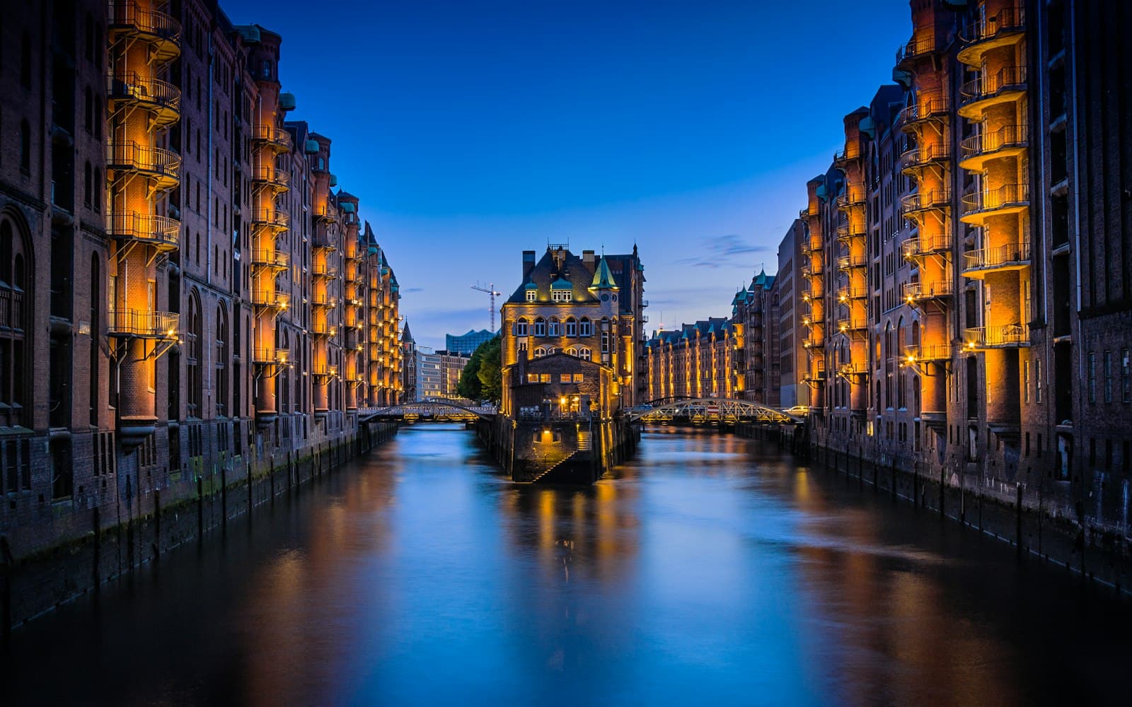 Hamburg — canal between buildings during nighttime