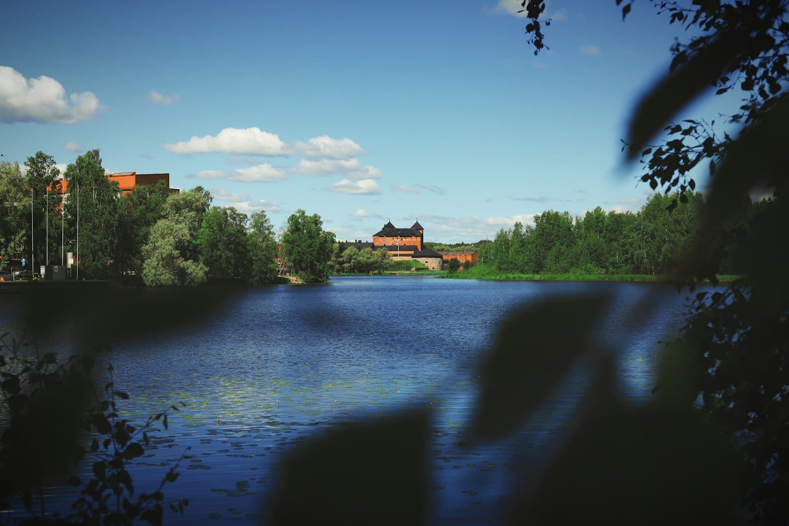 Hämeenlinna — A body of water surrounded by trees and buildings