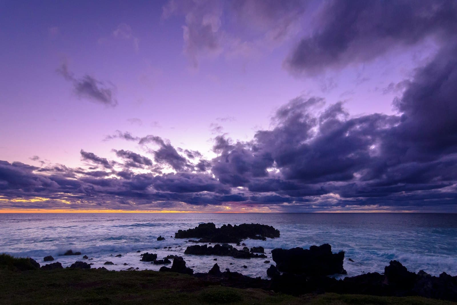 Hanga Roa — body of water under cloudy sky during daytime