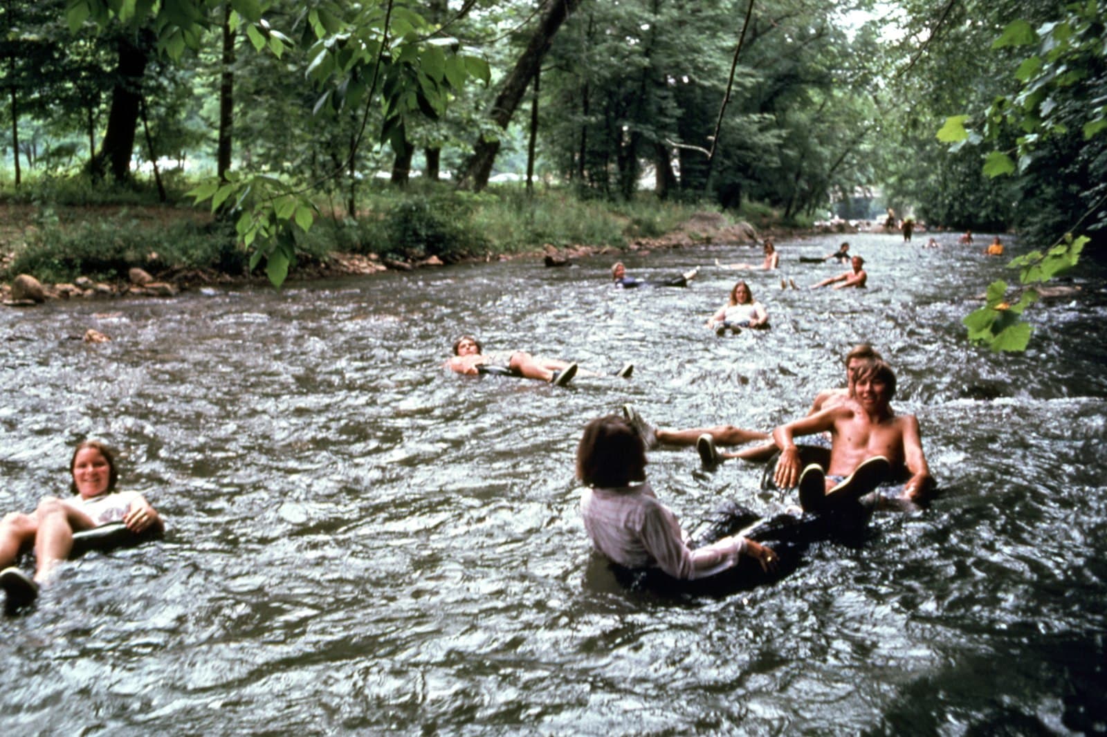Helen — a group of people swimming in a river