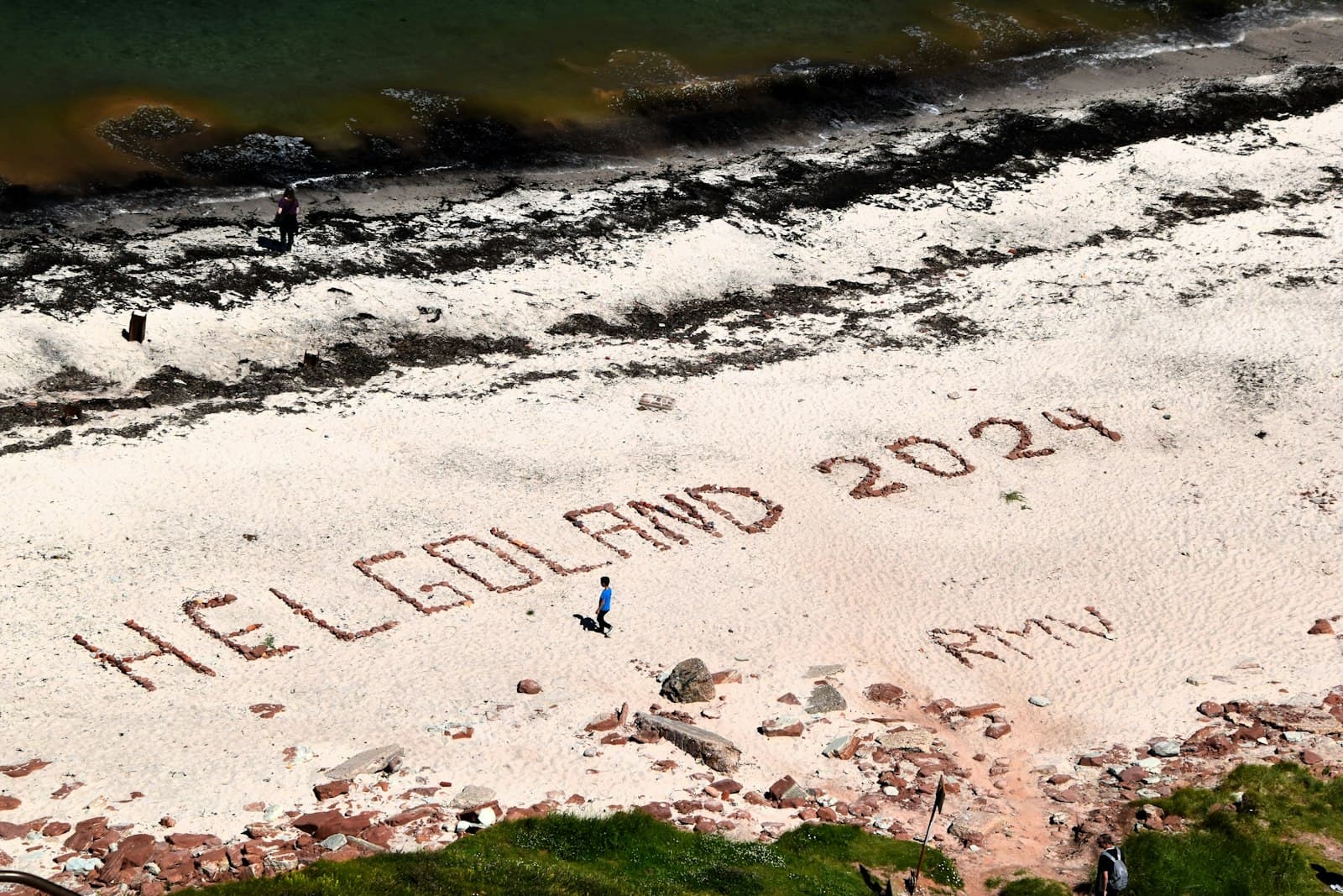 Heligoland — An aerial view of a sandy beach with writing on it