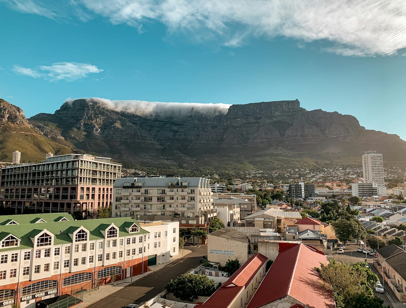 Hoedspruit — white and brown concrete buildings near gray mountain under blue sky during daytime