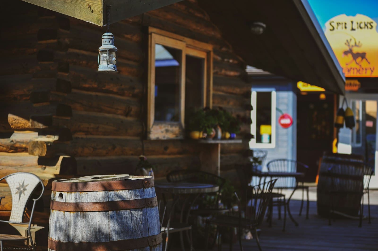 Homer — Rustic wooden building with outdoor seating area.