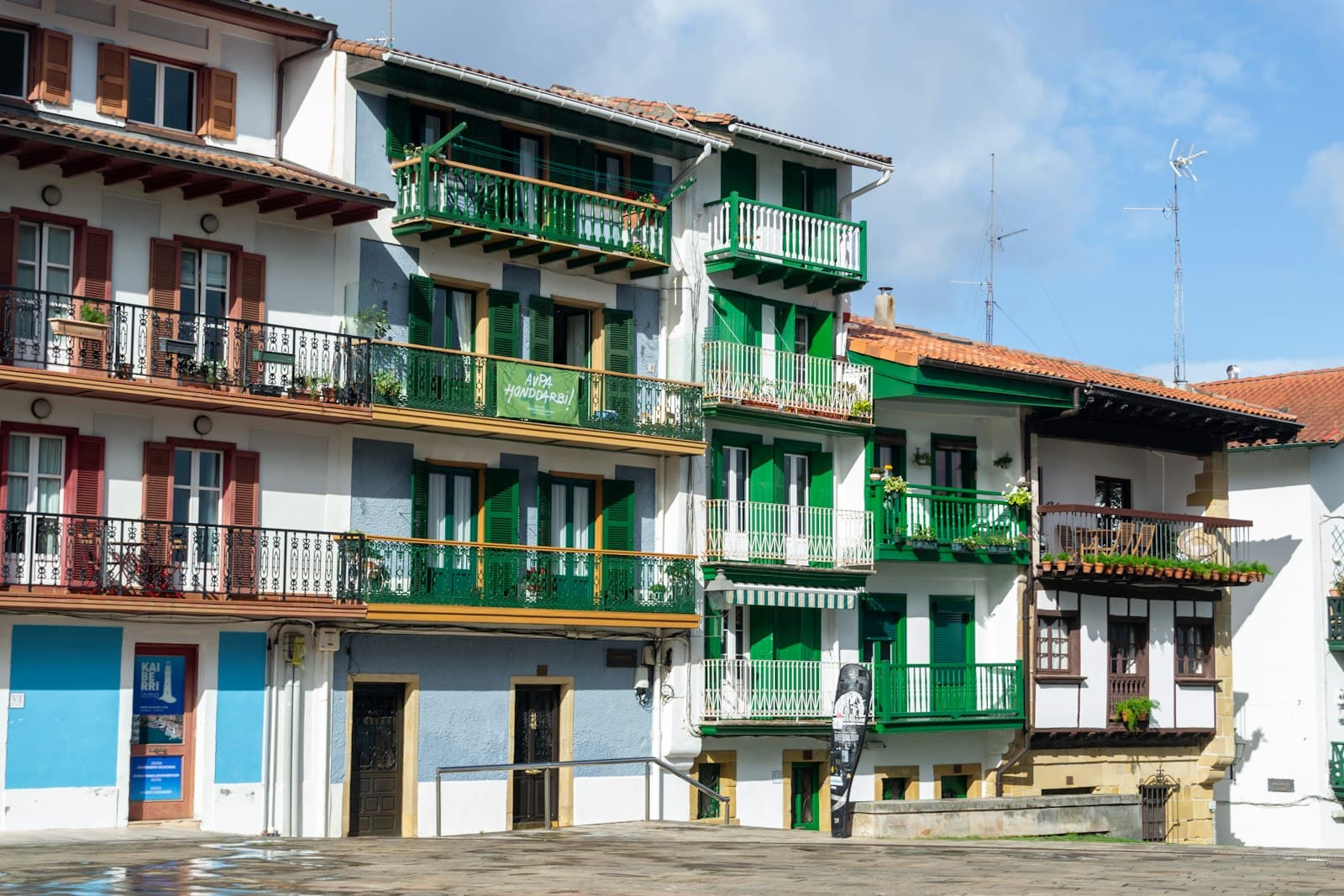 Hondarribia — a row of multi - story buildings with balconies and balconies on