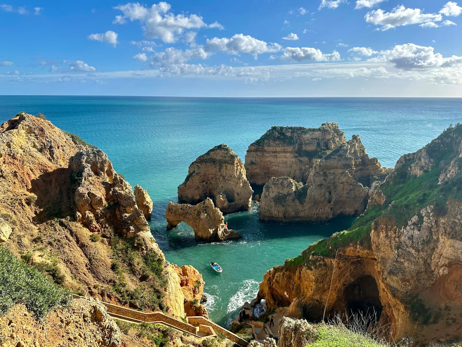 Horta — a scenic view of a body of water near a rocky cliff