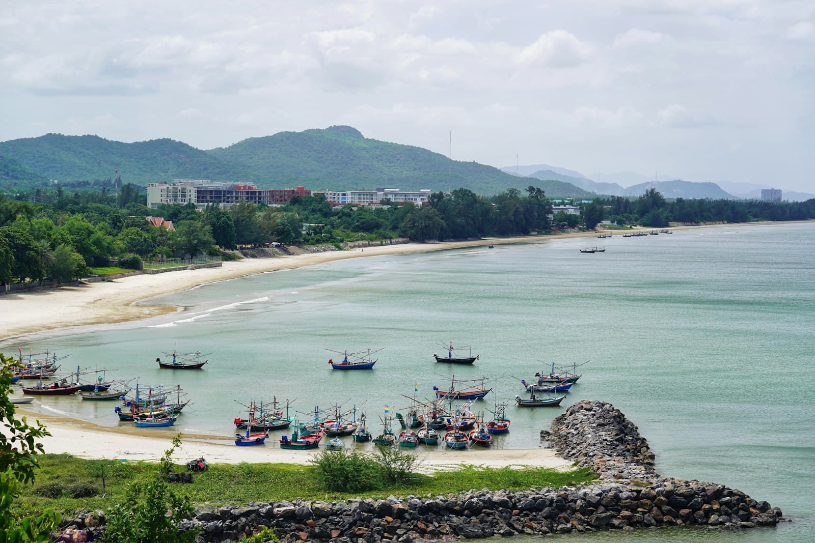 Hua Hin — boats on sea near green trees during daytime