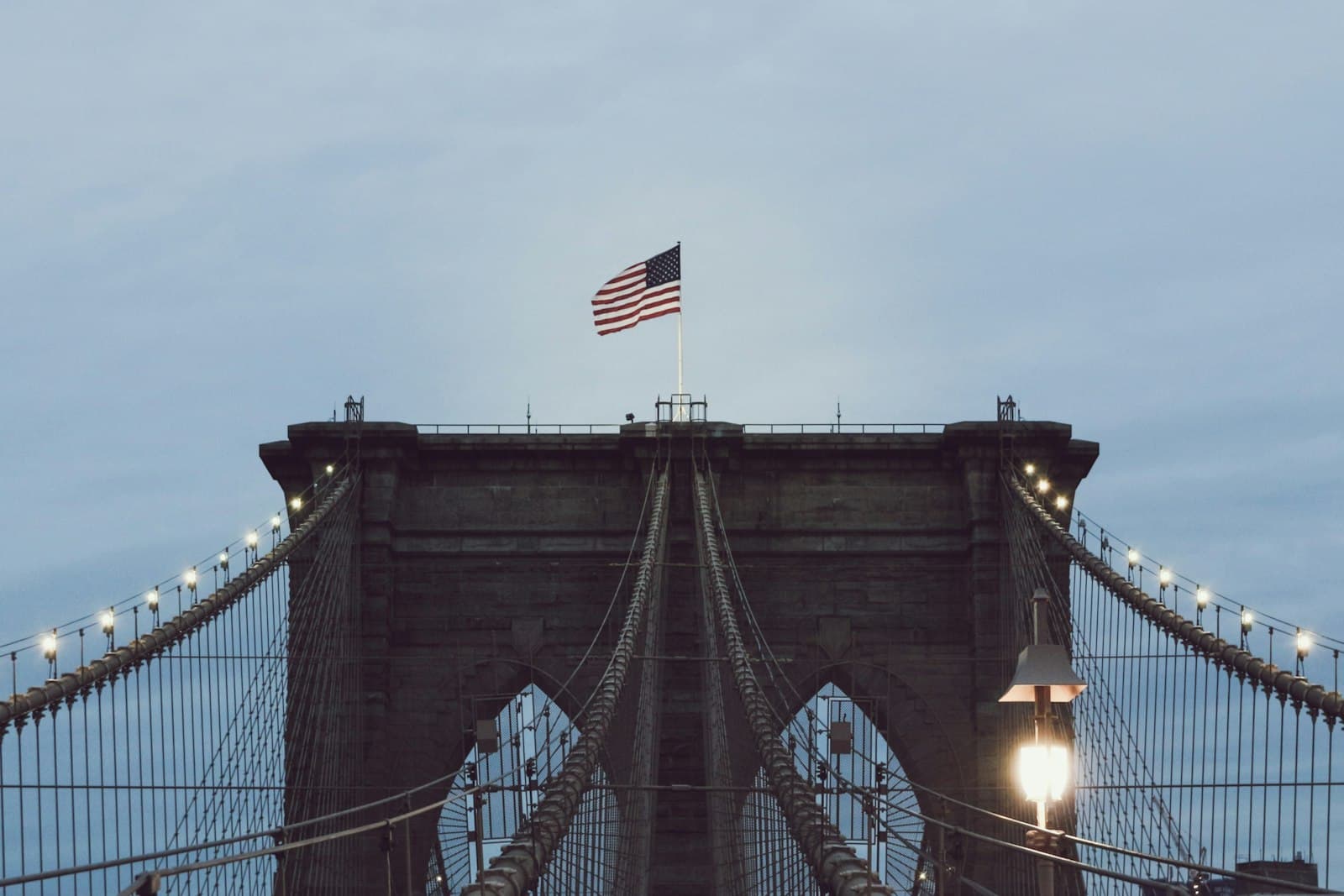 Hudson — Brooklyn Bridge with string lights