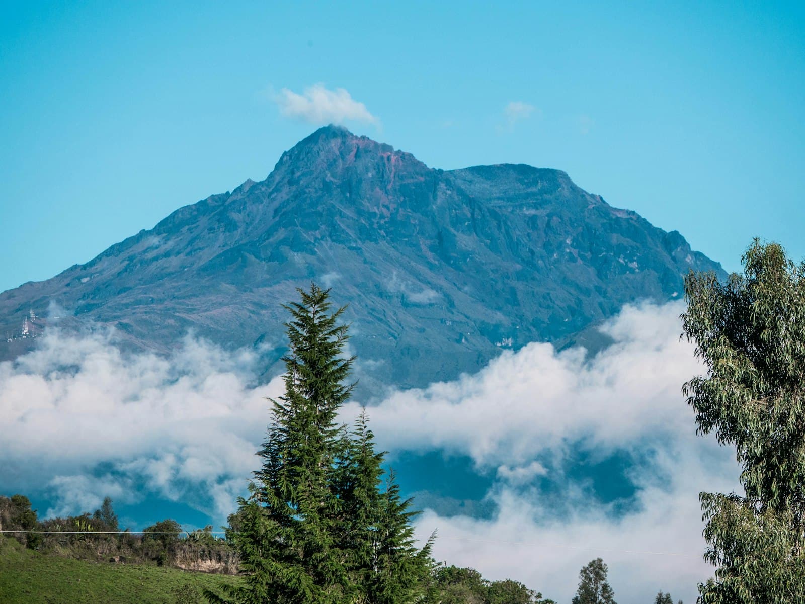 Ibarra — a view of a mountain with clouds and trees
