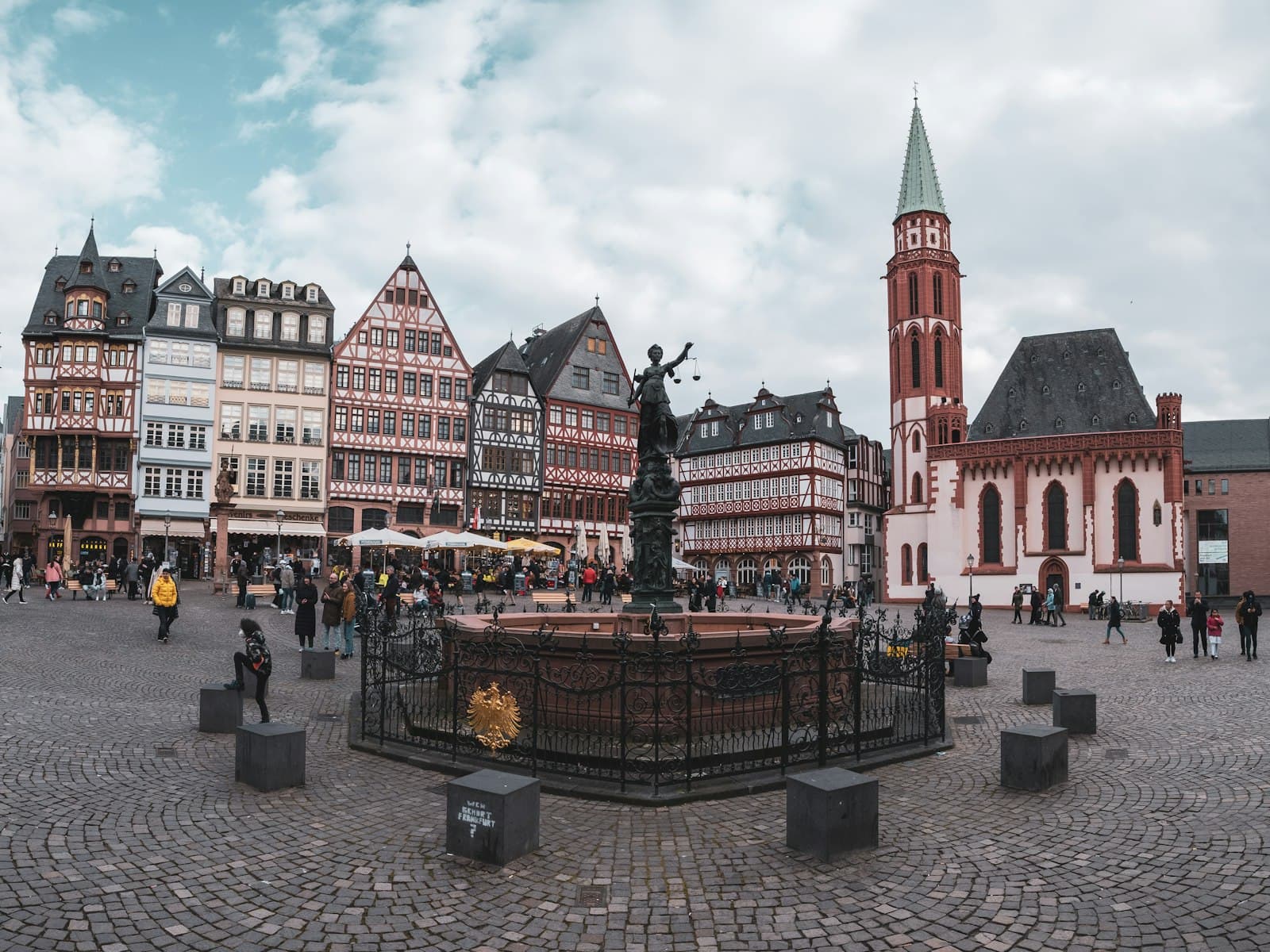 Iéna — a group of buildings with people walking around