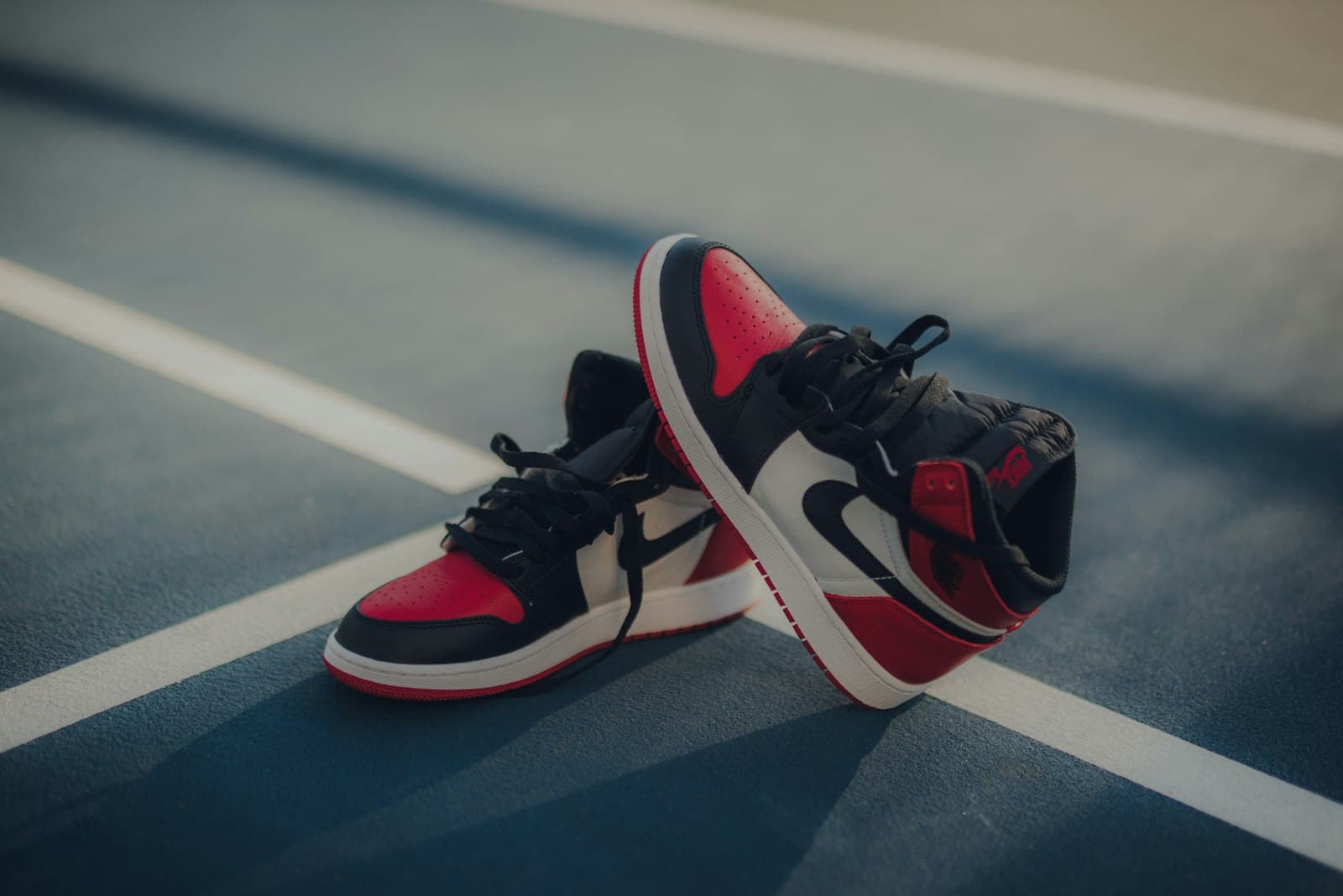 Irbid — pair of black-white-and-red Air Jordan 1 shoes