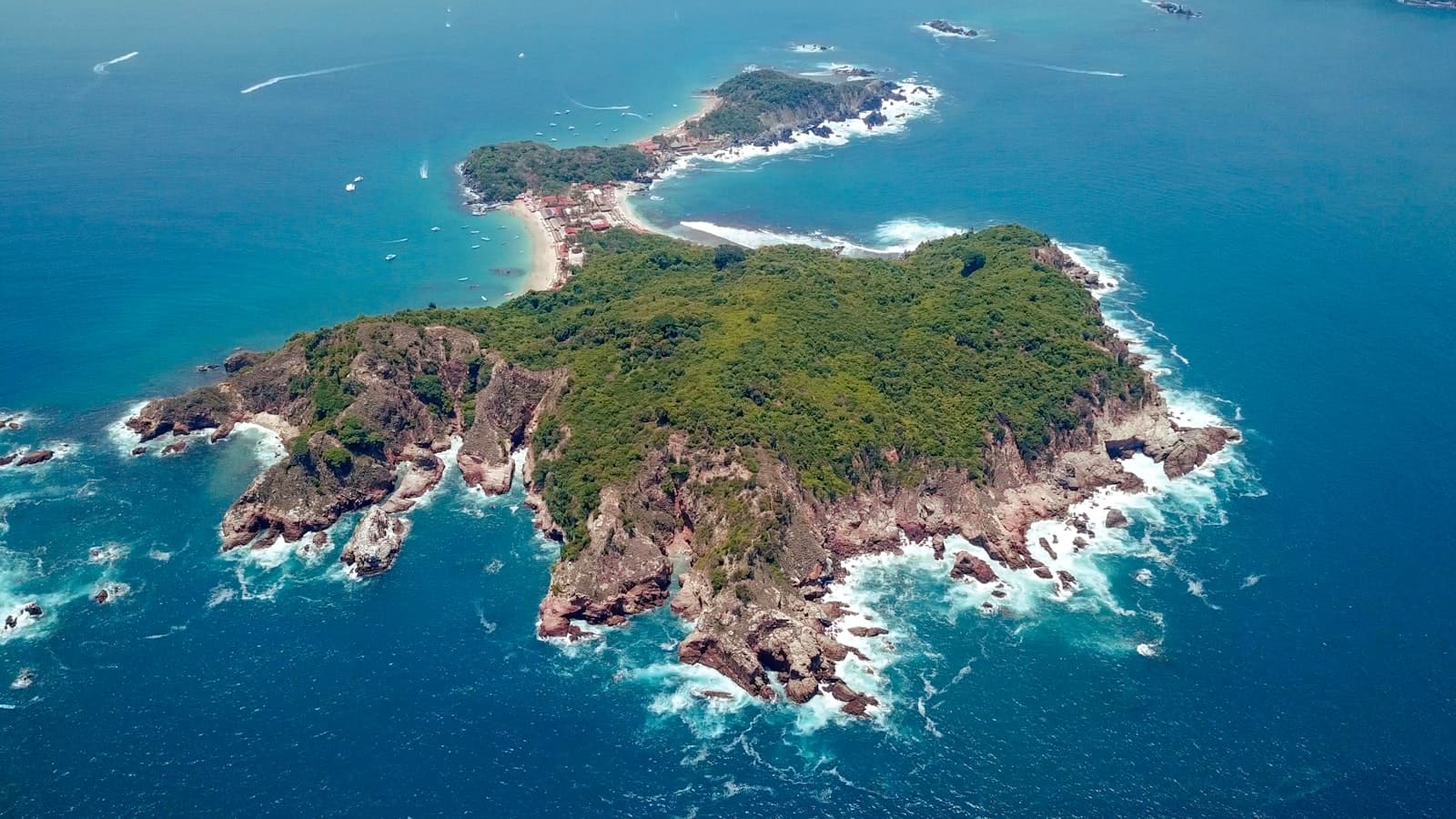Ixtapa — green and brown island in the middle of blue sea during daytime